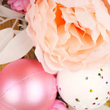 NNETM Blushing Elegance: A Pink Christmas Wreath Adorned with Baubles