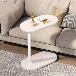 NNETM Pairing practicality with style, this C-shaped end table is a must-have