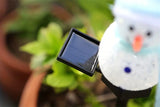 NNETM Radiant Solar Snowman Quartet: Festive Ground Plug-in Lights