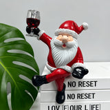 Red and White Resin Elderly Figure Ornament Seated Character Raising a Glass