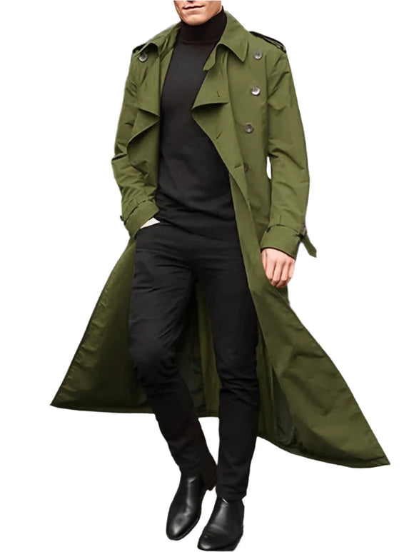 Person wearing a long green coat on a city street