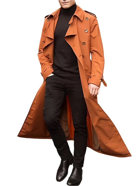 Person wearing an orange trench coat on a city street.