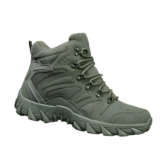 Green hiking boot on a rock with a gray background