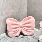 NNEDSZ Pink Creative Ceramic Bowknot Toothbrush Holder - Elegant Bathroom Storage for Electric Toothbrush and Toothpaste