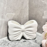 NNEDSZ White Creative Ceramic Bowknot Toothbrush Holder - Elegant Bathroom Storage for Electric Toothbrush and Toothpaste