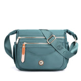 NNEDSZ Light Blue Nylon Crossbody Bag with Multiple Compartments - Compact and Stylish Design