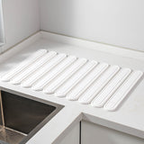 NNEDSZ White Oval Shaped Engraved Inner Frame Foldable Diatomaceous Earth Drying Mat - Super Absorbent, Fast-Drying, Non-Slip Kitchen Countertop Mat