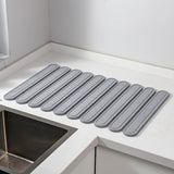 NNEDSZ Light Gray Oval Shaped Engraved Inner Frame Foldable Diatomaceous Earth Drying Mat - Super Absorbent, Fast-Drying, Non-Slip Kitchen Countertop Mat