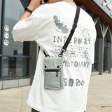 NNEDSZ Grey Water-Resistant Nylon Crossbody Phone Bag – Compact Travel Wallet & Card Holder for Men and Women(Mobile phones and cards are shooting props, not included)