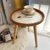 NNETM Understated elegance meets Nordic sensibilities in the Rattan Shell Table